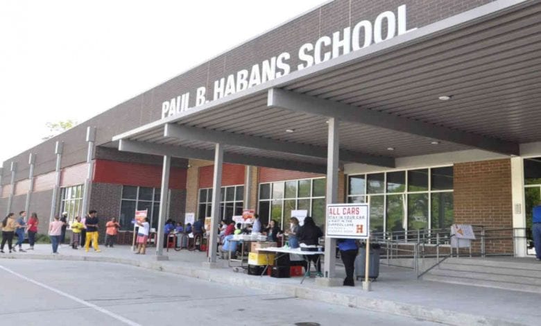 Post-school closure meal handouts at Paul Habans Charter School last month. Habans is up for a charter renewal next school year. The CEO of the network that runs the school said it’s important to hear from the state soon about how the NOLA Public Schools District should evaluate charters. (Marta Jewson/TheLens)